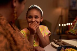Kid laughing at family joke