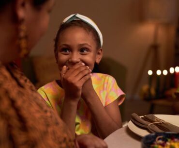 Kid laughing at family joke