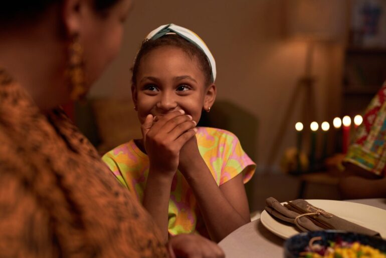 25 holiday jokes to tell your kids on Halloween, Valentine’s Day, and more Kid laughing at family joke