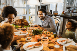 Family gathered around holiday table