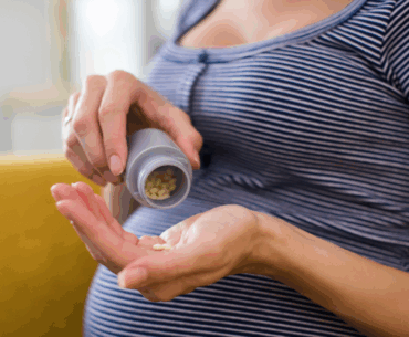 Pregnant woman taking medicine