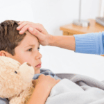 Mom comforting a sick child
