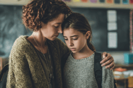 Mom comforting teen daughter
