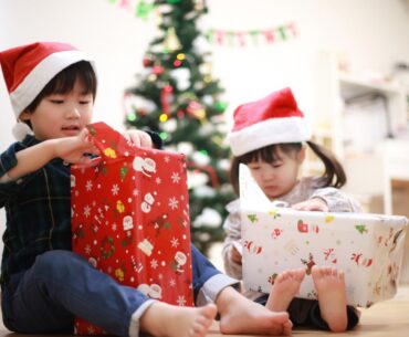 Kids unwrapping holiday presents