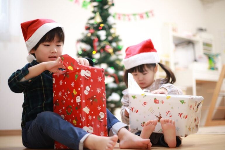 Are these 5 creepy tech toys on your kid’s list this year? Kids unwrapping holiday presents