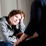 Preteen boy talking to parent