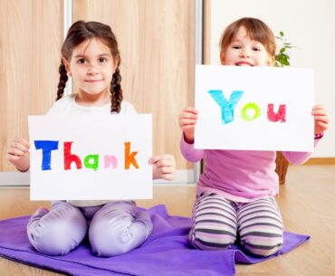 Kids holding thank you signs