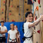 Teen at indoor climbing wall