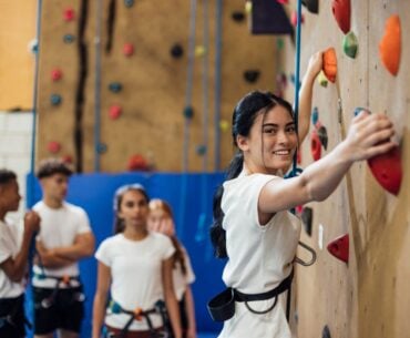 Teen at indoor climbing wall
