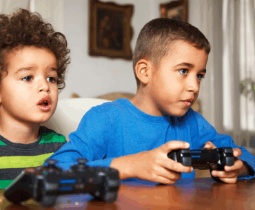 Young boys playing video game