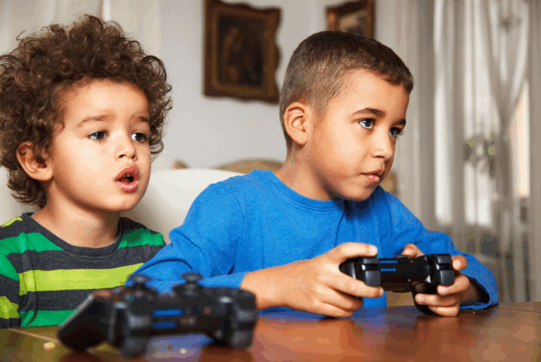 When is scary or violent content actually harmful to kids? Young boys playing video game