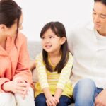 Child having conversation with parents