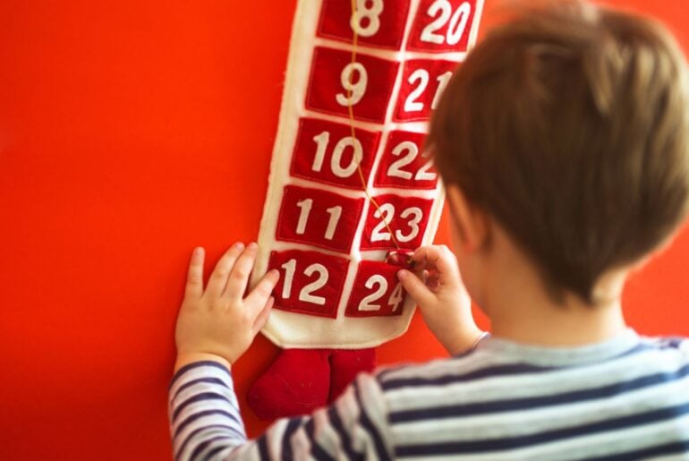 Kid using advent calendar