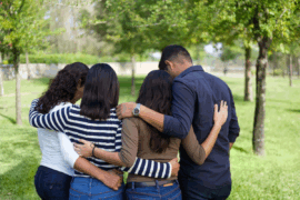 Loving family in embrace.