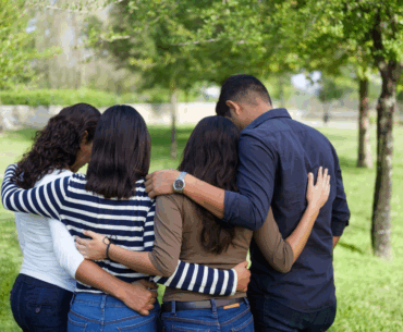 Loving family in embrace.