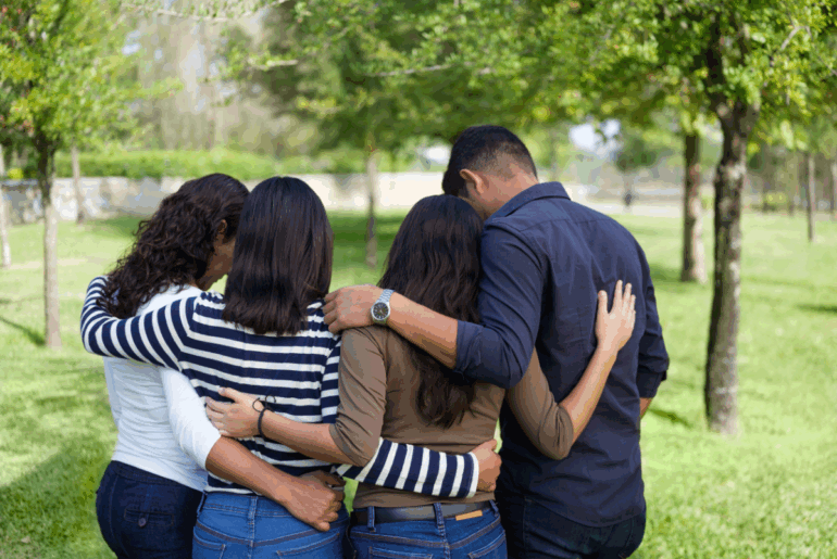 Loving family in embrace.