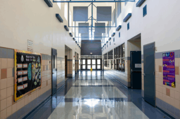 Teachers union celebrates win for public schools after Trump administration withdraws DEI appeal School hallway