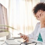Doctor feeling overwhelmed and frustrated
