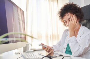 Doctor feeling overwhelmed and frustrated