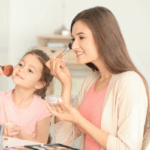 Mom and daughter putting on makeup