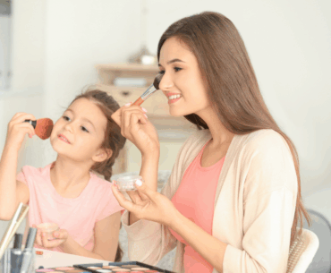 Mom and daughter putting on makeup