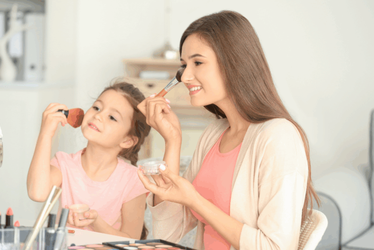 Mom and daughter putting on makeup