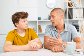 Father talking to teen son