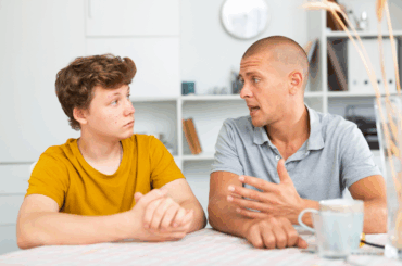 Here’s what to say if your child or teen asks you about the Epstein files Father talking to teen son