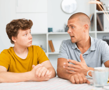 Father talking to teen son