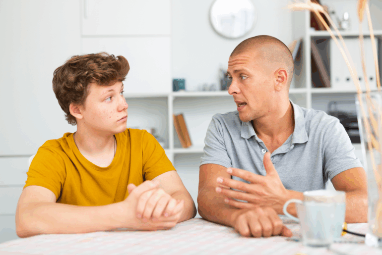 Father talking to teen son