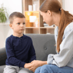 A mom holds her young child's hand and makes amends