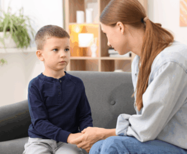 A mom holds her young child's hand and makes amends