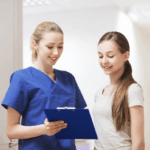 Nurse and teen talking during an exam