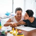 Parent working with disabled young adult