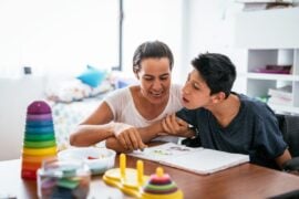 Parent working with disabled young adult
