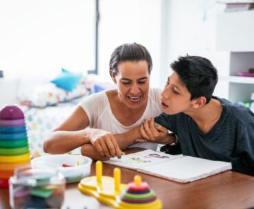Parent working with disabled young adult