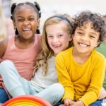 Smiling kids with different hair textures