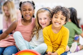 Smiling kids with different hair textures