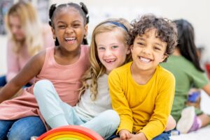 Smiling kids with different hair textures