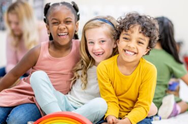 Smiling kids with different hair textures