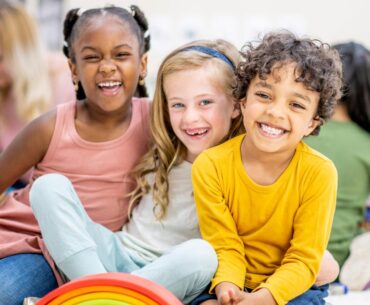 Smiling kids with different hair textures