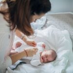 Woman taking care of newborn
