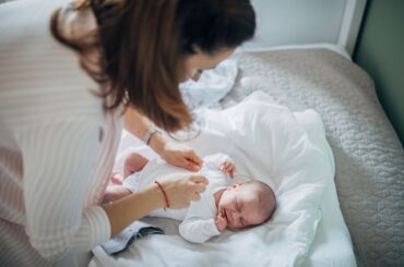 Woman taking care of newborn