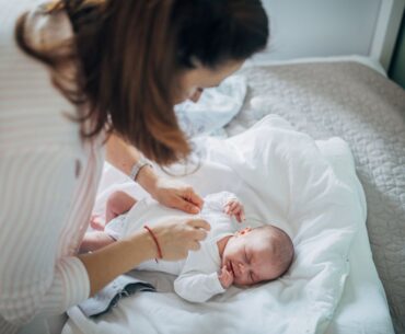 Woman taking care of newborn