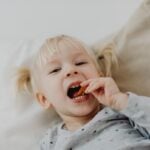 Little girl eating chips