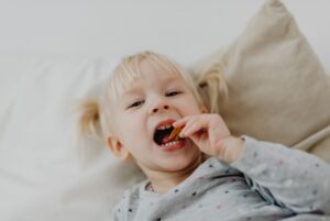 Little girl eating chips