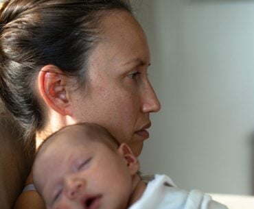 Sad lonely mother with newborn