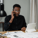 Man on the phone paying bills