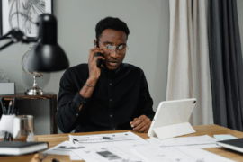Man on the phone paying bills