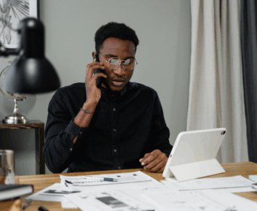 Man on the phone paying bills